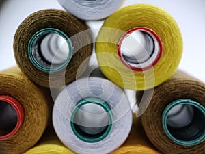 Colorful Spools of Sewing Thread on White Background