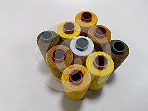 Colorful Spools of Sewing Thread on White Background