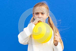 Close up photo of nice pretty lovely girl inflate ballon have free time positive cheerful funny girl isolated on blue