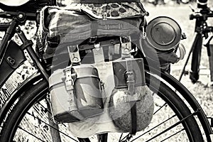 Close up photo of old military bicycle with equipment, black and