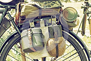 Close up photo of old military bicycle with equipment, retro photo filter