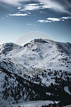 Close up photo of one of nocky mountains covered in snow in Austria.