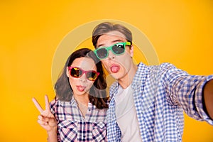 Close up photo of pair in summer specs he him his she her lady boy make take trip weekend common selfies tongue out of