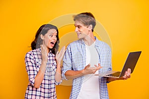 Close up photo of pair teens he him his she her lady boy with computer in hands great news won play pen-friend comes to