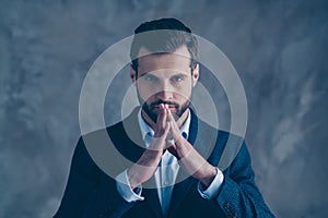 Close up photo of pensive man touching fingers having thoughts wearing blazer jacket  over grey background