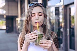 Close up photo portrait of nice glad charming beautiful funny funky cheerful cute pleased with closed eyes enjoying cool ice tea