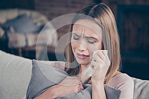 Close-up photo portrait of sad crying she her lady holding white paper tissue in hand closing eyes