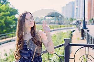 Close-up photo portrait of sweet charming with nice hairstyle lady waving palm to girlfriend standing near railings looking up to