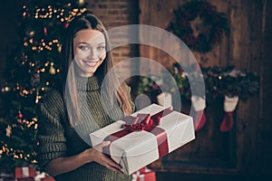 Close up photo of positive cheerful girl hold gift box from christmas father fairy north pole creature enjoy newyear