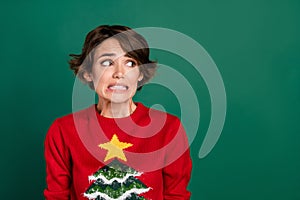 Close up photo of prety girl uglu pullover looking empty space oops make problem excuse isolated on bright yellow color