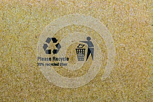 Close up photo of the recycle symbol printed on recycled cardb