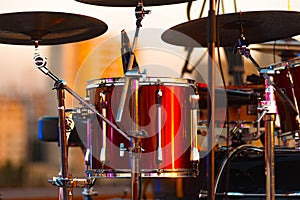 A close up photo of red drums on the stage