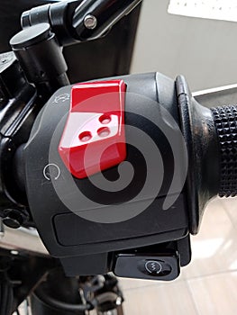 Close-up photo of a red engine stop button
