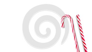 Close up photo of a red and white candy cane on a white background. Isolated Candy Cane with copy space. Concept of holiday and