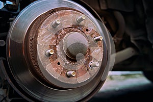 Close. up photo the rusty car brake rotor in automobile workshop