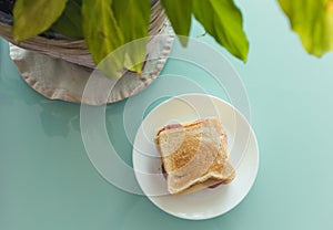 Close up photo of sandwich on a crystal table