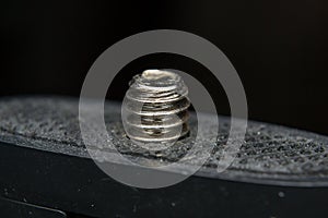 Close-up photo of a screw used in phoography industry photo