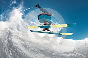 Close-up photo of skier jumping over camera