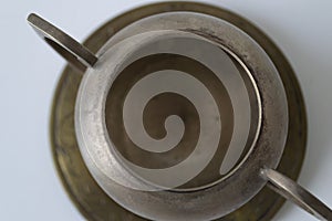 Close-up photo of a small vintage metal bowl