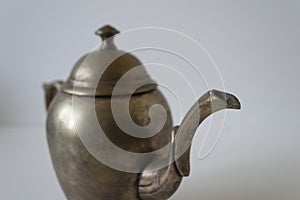 Close-up photo of a small vintage metal kettle