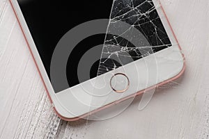 Close up photo of an smart phone with broken protective glass