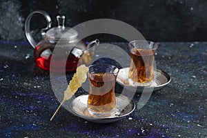 Close up photo of tea table. Teapot and two glass tea