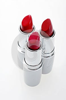 A close up photo of three lipsticks