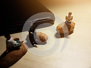 Conceptual Close Up Photo, Two Man Chit Chat and one other sit at peeled peanut enjoy with his smartphone in the afternoon, illust photo