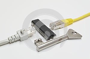 Two network connection plugs divided by a microchip and a key on