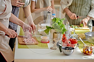 Close-up Photo of Unrecognizable People Hands Holding Knife Cutting Food Meal For Cooking, Preparing Dinner