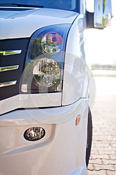 Close-up photo of white modern minibus