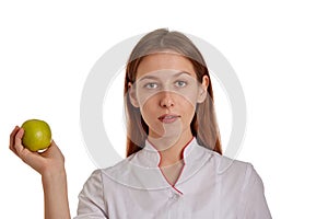 Close-up photo of a woman doctor in a white coat. The doctor monitors the records of the medical history, drugs and the