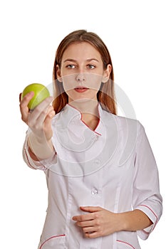 Close-up photo of a woman doctor in a white coat. The doctor monitors the records of the medical history, drugs and the