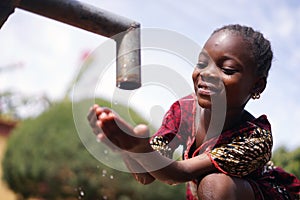 Close up Photograph of African Black Girl Drinking Safe Water from Tap