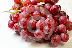 A Close-up Photograph of a Bunch of Red Grapes