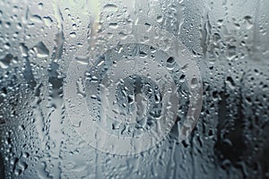 Close-up photograph capturing pristine water droplets delicately resting on a clear glass surface, creating a serene.