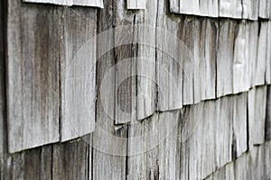 Close up photograph of rustic wooden tiles on a house in the Caribbean