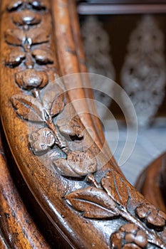 Close up photograph showing detail on the carved wooden handrail of the sweeping staircase at The Grand Hotel, Brighton, UK