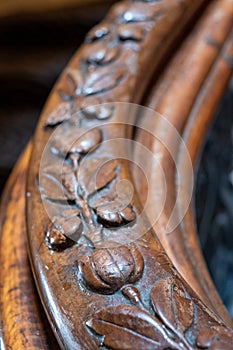 Close up photograph showing detail on the carved wooden handrail of the sweeping staircase at The Grand Hotel, Brighton, UK