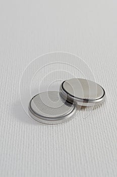 A Close-up Photograph of two Button Cell Batteries