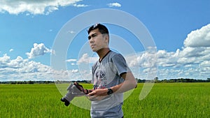 Close up of photographer in green rice field.