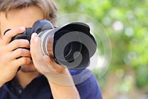 Close up of a photographer using a dslr camera photo