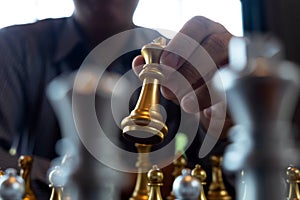 Close-up photos of checkmate hands on a chessboard during a chess game The concept of business victory strategy wins the intellige