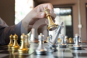 Close-up photos of checkmate hands on a chessboard during a chess game The concept of business victory strategy wins the intellige