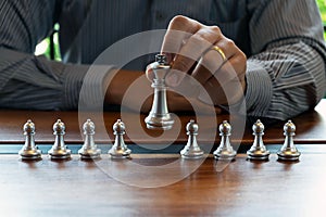 Close-up photos of checkmate hands on a chessboard during a chess game The concept of business victory strategy wins the intellige