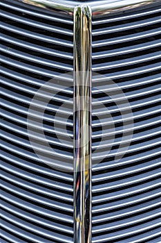 Close up photos of the grill of a classic car