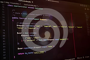 Close-up of PHP Laravel code on a dark editor screen, showcasing user update function and password hashing. Ideal for programming