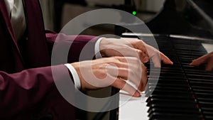 close up of pianist performing in suit