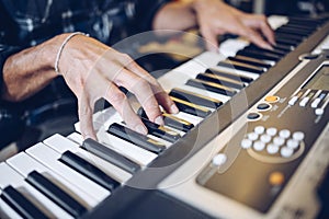 Close up of pianist`s hands on the keyboard