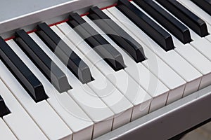 close-up of piano keys. close frontal view, black and white piano keys, viewed from above